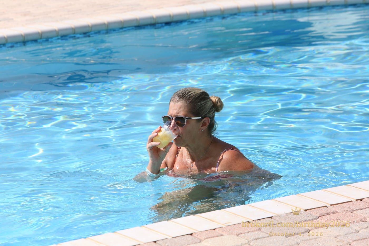 Guest smiling and relaxing in the swimming pool — Karina Leal's birthday, October 4, 2026.