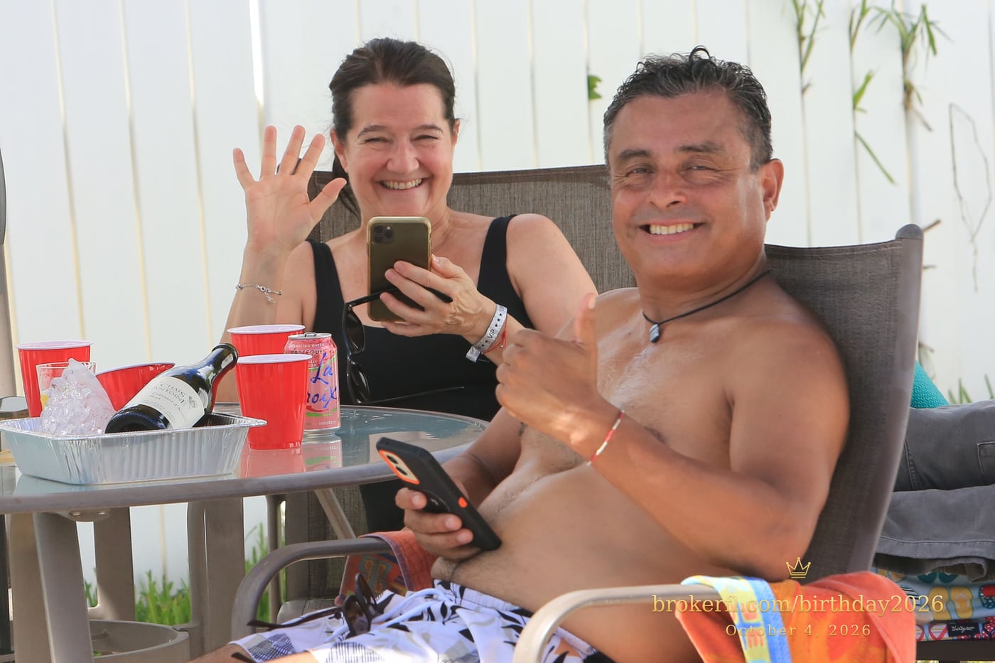 Friends sharing a table on the poolside patio — Karina Leal's birthday, October 4, 2026.
