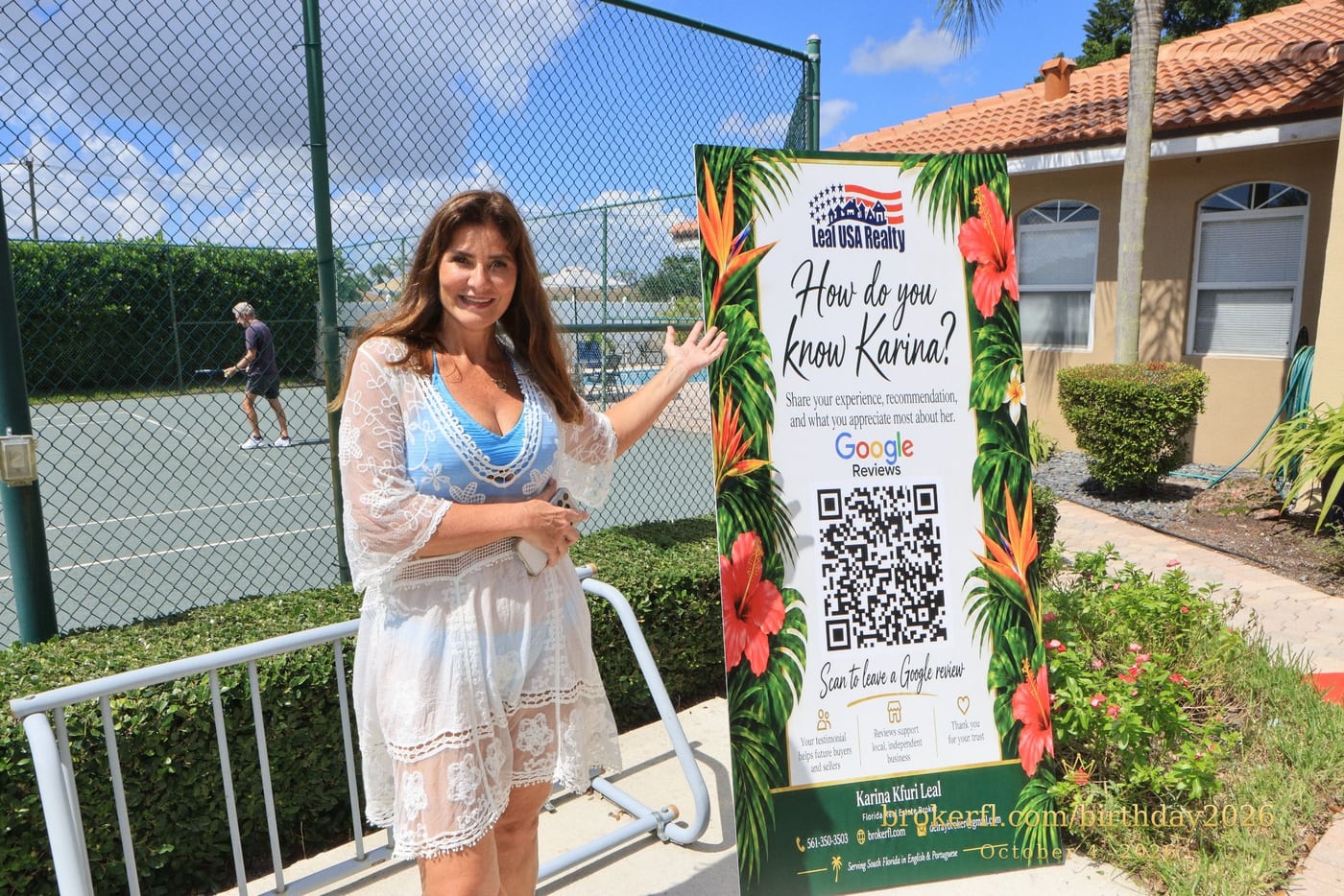 Guest in a white lace cover-up beside the tropical welcome sign — Karina Leal's birthday, October 4, 2026.