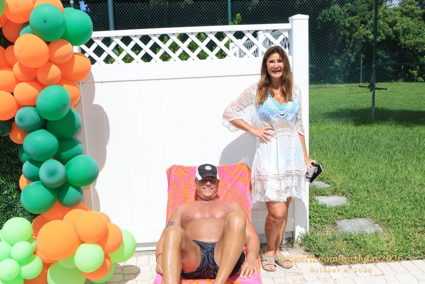 Guests beside the balloon backdrop and a poolside lounge chair — Karina Leal's birthday, October 4, 2026.
