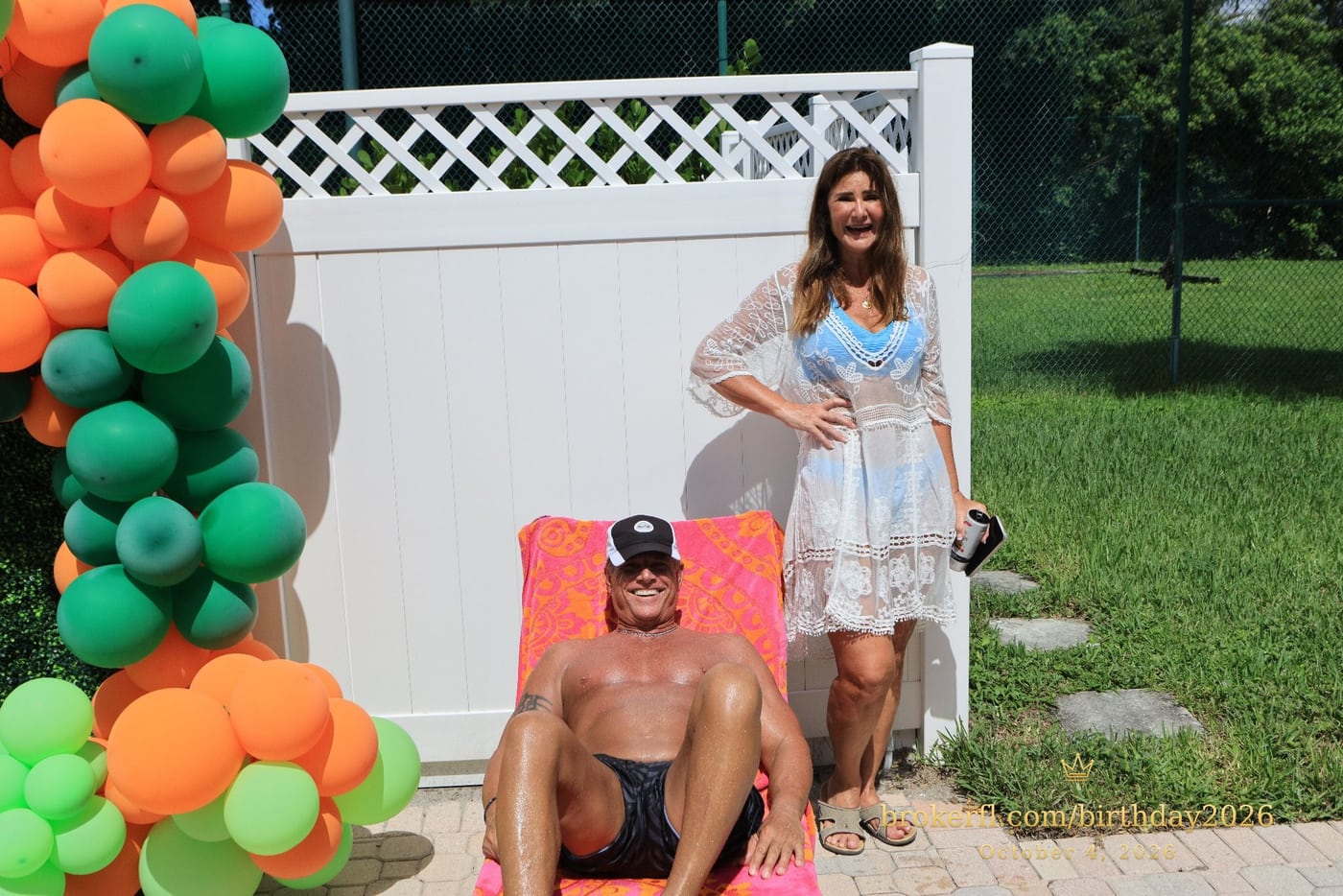 Guests beside the balloon backdrop and a poolside lounge chair — Karina Leal's birthday, October 4, 2026.
