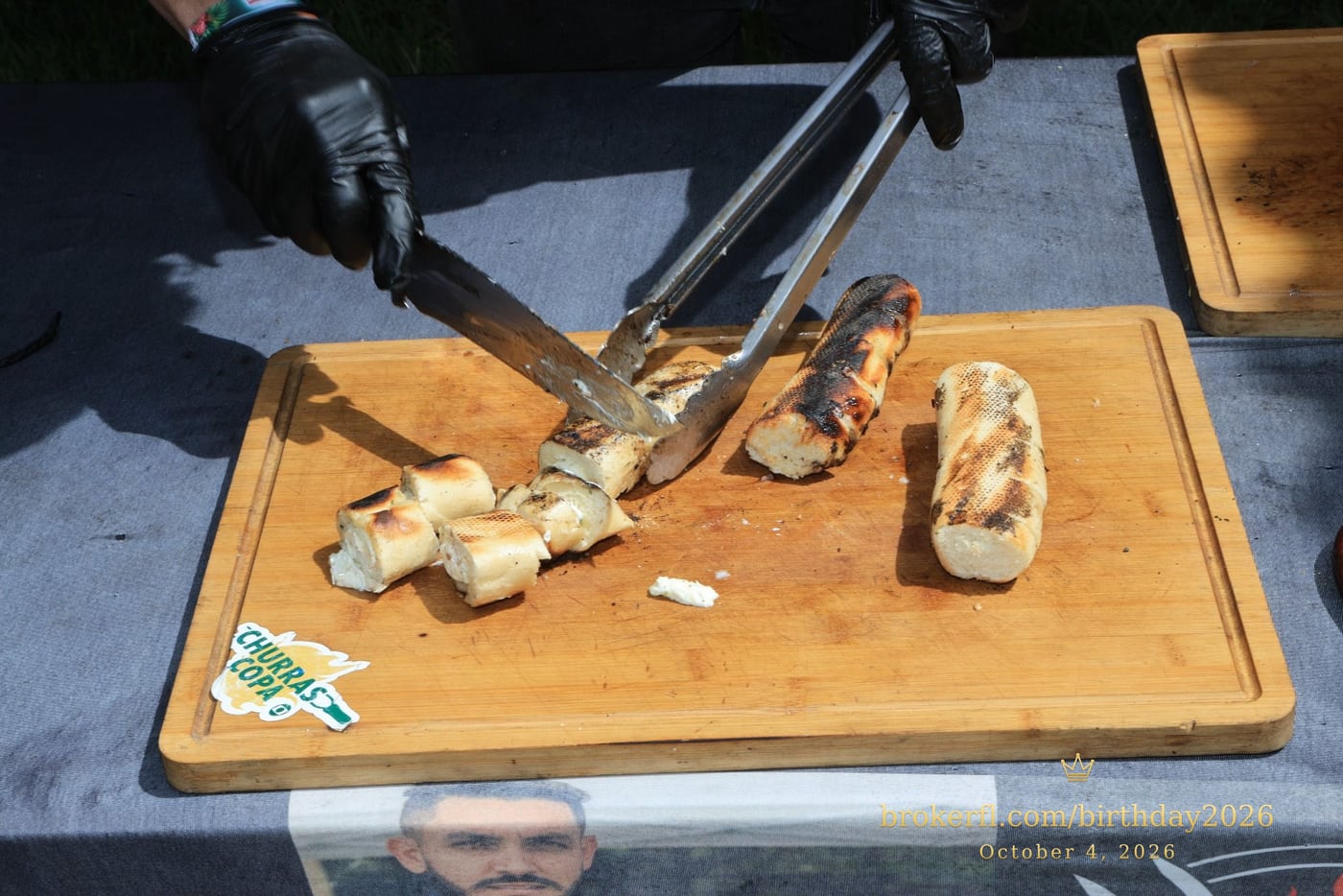 Sliced barbecue meat on a wooden serving board — Karina Leal's birthday, October 4, 2026.