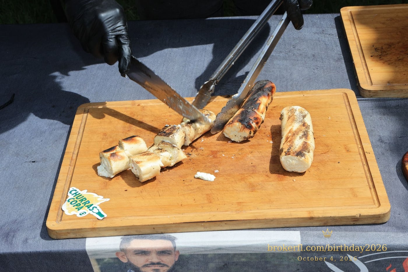 Sliced barbecue meat on a wooden serving board — Karina Leal's birthday, October 4, 2026.