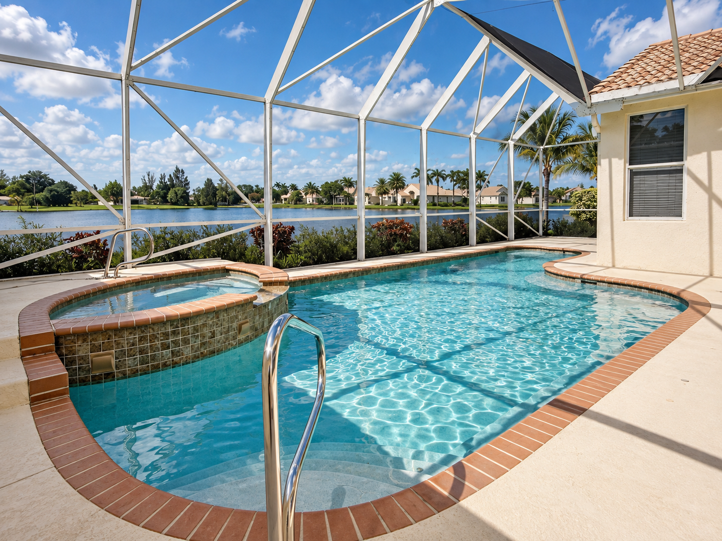 Private pool, raised spa and lake view at 9360 Cove Point Circle in Verona Lakes